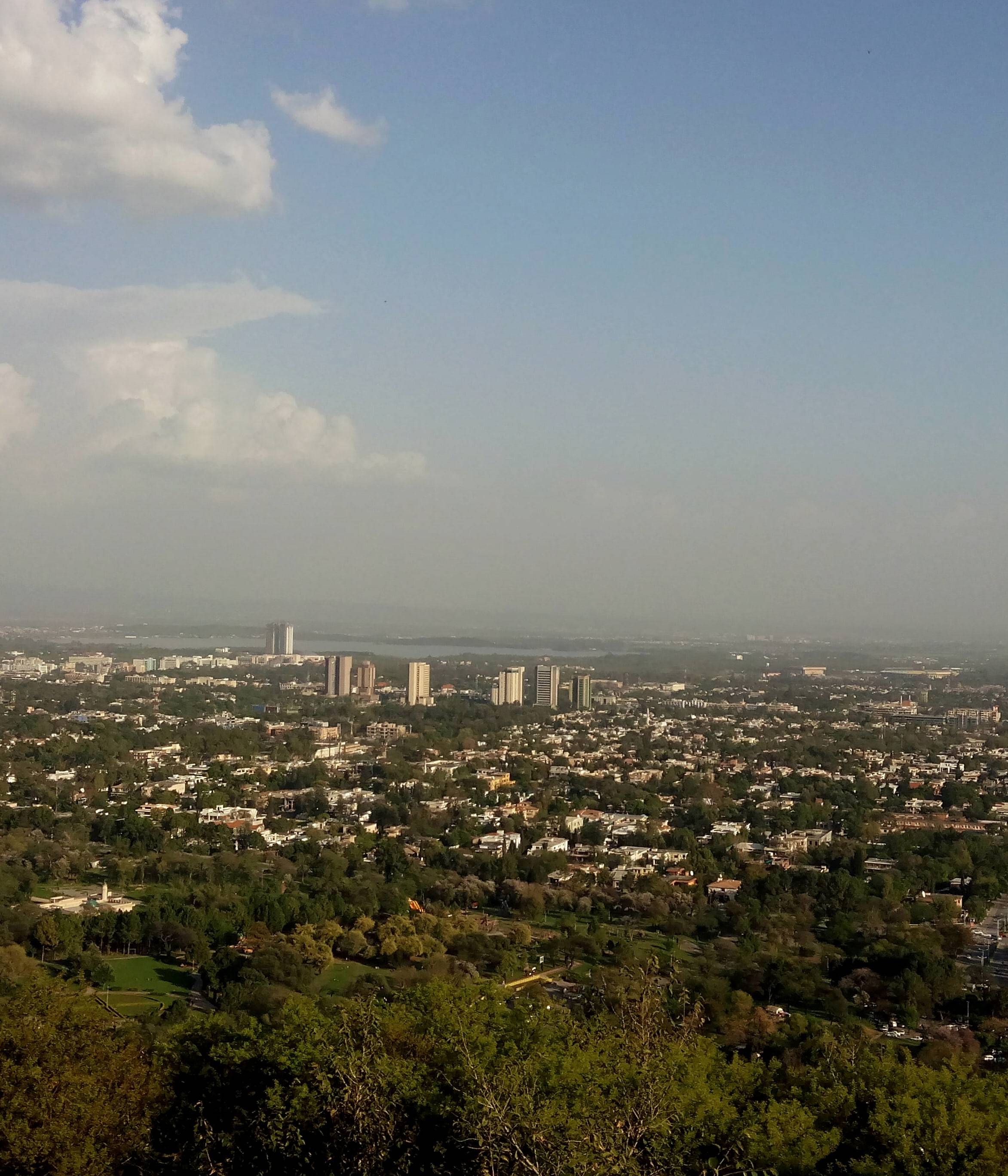 Islamabad spread out below the Margalla Hills, seen from Daman-e-Koh at dusk