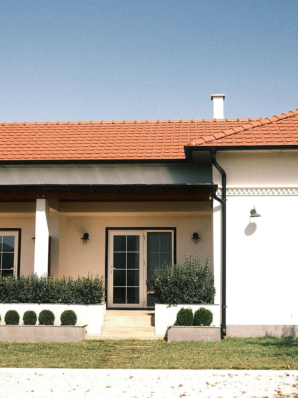 A detached modern villa with a landscaped garden